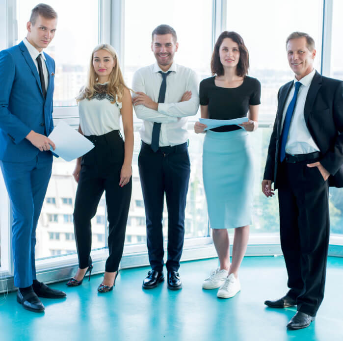 group confident businesspeople standing office 1 1